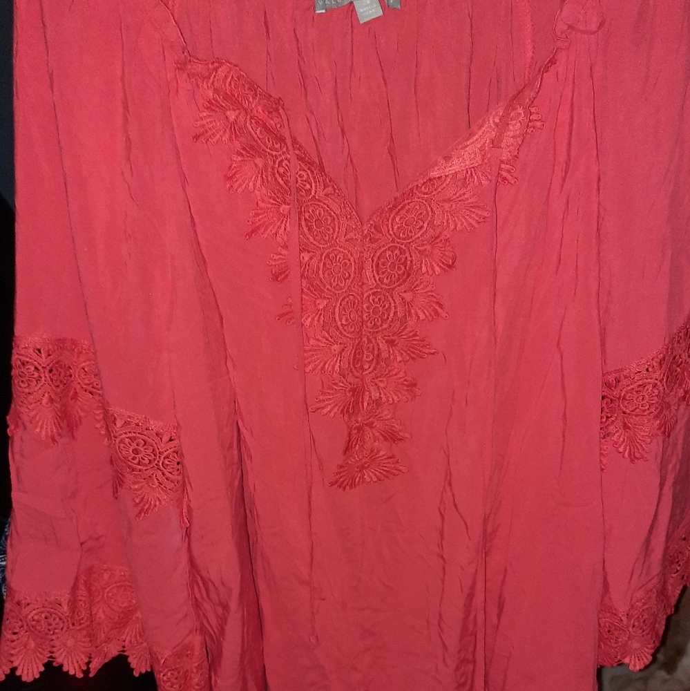 Valerie Steven's orange/coral shirt